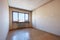 Empty room interior with wooden floor, dirty walls