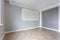 Empty room with minimal preparatory repairs with crown molding. interior of white and gray walls