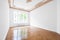 Empty room with parquet floor and stucco ceiling - new renovated