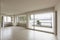 Empty room with radiators and large window overlooking Lake Lugano