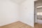 Empty room in a renovated apartment with plain white painted walls,
