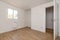 Empty room in a renovated apartment with white painted walls,