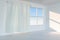 An empty room with sunshine come through the curtain, 3d rendering