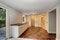 Empty room with a washbasin cabinet and brown tile floor.