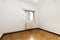 Empty room with white aluminum radiator with parquet floors and double