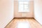 Empty room with window and wooden floor