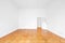 Empty room with wooden parquet floor refurbished apartment