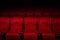 Empty rows of red theater or movie seats