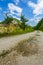 Empty rural road through mountain clifs