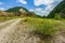 Empty rural road through mountain clifs