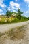 Empty rural road through mountain clifs