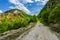 Empty rural road through mountain clifs