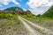 Empty rural road through rugged terrain