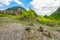 Empty rural road through rugged terrain