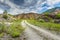 Empty rural road through rugged terrain