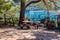 Empty rustic round wooden table and stools in park  in Kemer, Turkey