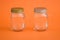 Empty Salt, Pepper Shakers on Orange Background