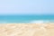 Empty sand beach in front of summer sea background with copy space