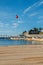 Empty sandy Praia do Ribeiro and boats on bay a a sunny summer morning. Cascais is a small quaint village 30km west of