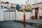 Empty school asphalt playground in the backyard with three color baskets for basketball and part for handball in background