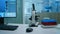 Empty science research laboratory office with microscope on table