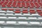 Empty seats in the stands of the arena or auditorium. Rows of red and white seats with no spectators. The concept of the abolition