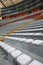 Empty seats in the stands of the arena or auditorium. Rows of red and white seats with no spectators. The concept of the abolition