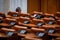 Empty seats and very few MPs in a Romanian Parliamentâ€™s Chamber of Deputies Meeting during the covid-19 lockdown