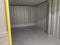 An empty self storage unit room that has been cleared