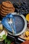 Empty serving blue plate with fork spoon in frame of food ingredients gastronomy appetizer snacks grapes cheese wine