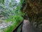 Empty Shakadang Trail along cliffs and trees with Liwu River on the side in a mist during the pandemic before 403