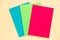 Empty sheets of colored paper on pink background. Children`s creativity concept