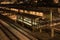 Empty shelter with lights on lonely train platform waiting for passengers