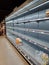 Empty shelves in the grocery store. Scarcity of food for the consumer