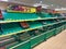 Empty shelves in a high street supermarket. These shelves would normally be stocked full of fresh food