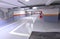 Empty shopping mall underground parking lot or garage interior with concrete stripe painted columns