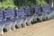 Empty sitting benches made by stone and concrete on a railway platform.