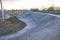 Empty skatepark in Poland, after sunset. Concrete bowls at playground