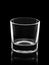 Empty small shot glass isolated on black