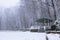 Empty snow-covered arbour in Park