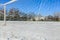 Empty snowy soccerball field