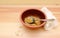 Empty soup bowl with breadcrumbs and a napkin