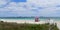 Empty South Beach in Miami Beach, Florida under coronavirus beach closure with cruise ships in background.