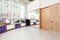 Empty space in fitness center, white brick walls, natural wooden floor and big windows, modern loft studio, rolled yoga mats, comf