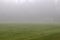 Empty sports field in fog