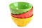 Empty, stacked, colored bowls (red, yellow, green), isolated on