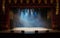 An empty stage of the theater, lit by spotlights and smoke