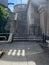 Empty stairwell with no people in downtown Chicago Loop along riverwalk with shadow patterns on walkway