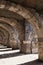 Empty stone gallery with arcs and columns