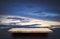 Empty stone shelf on dramatic blue sky